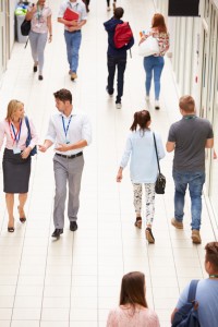Busy Hallway In College With Students