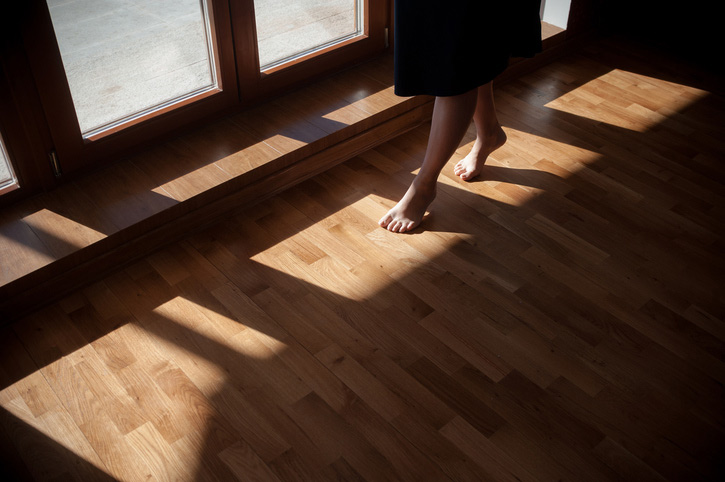 Woman walks on squeaky wood floor