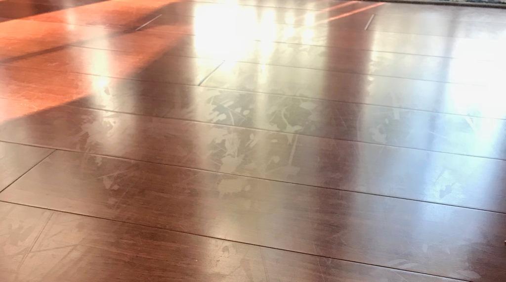 wood floor with cloudy scuff marks