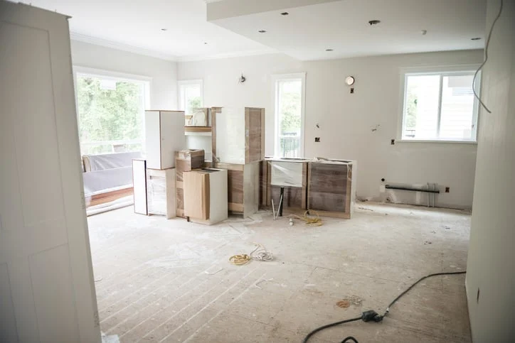 unfinished kitchen with cabinets sitting in the middle of the room