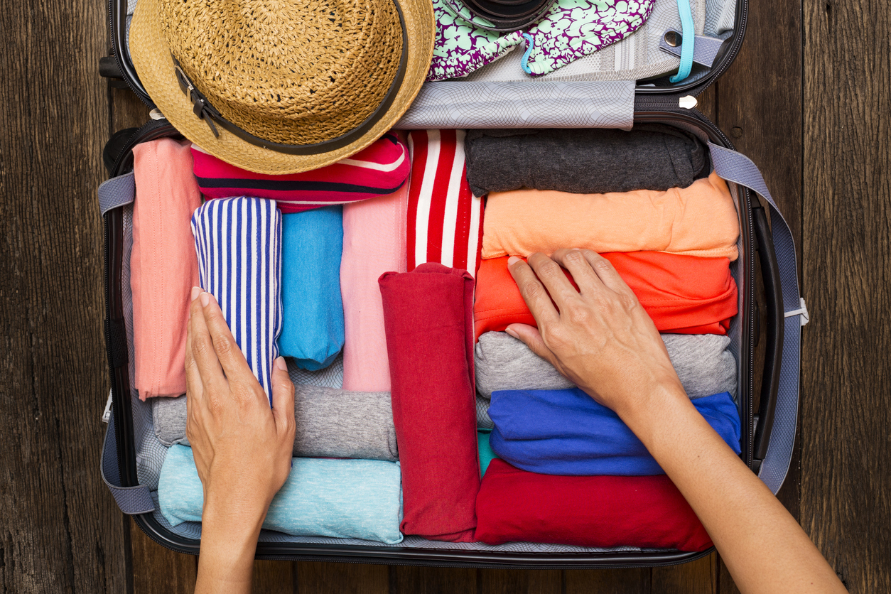 woman packing a luggage for a new journey