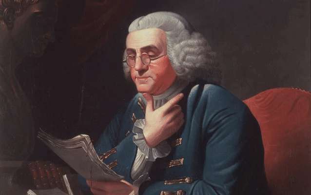 A painting of Benjamin Franklin reading papers