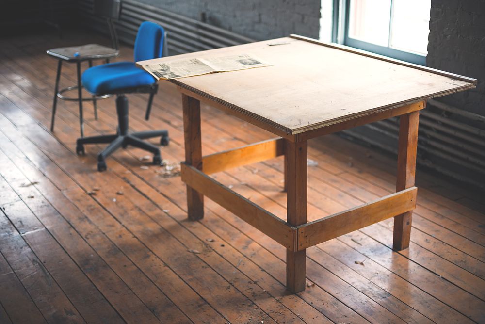 photo of rectangular brown wooden desk on bamboo floor