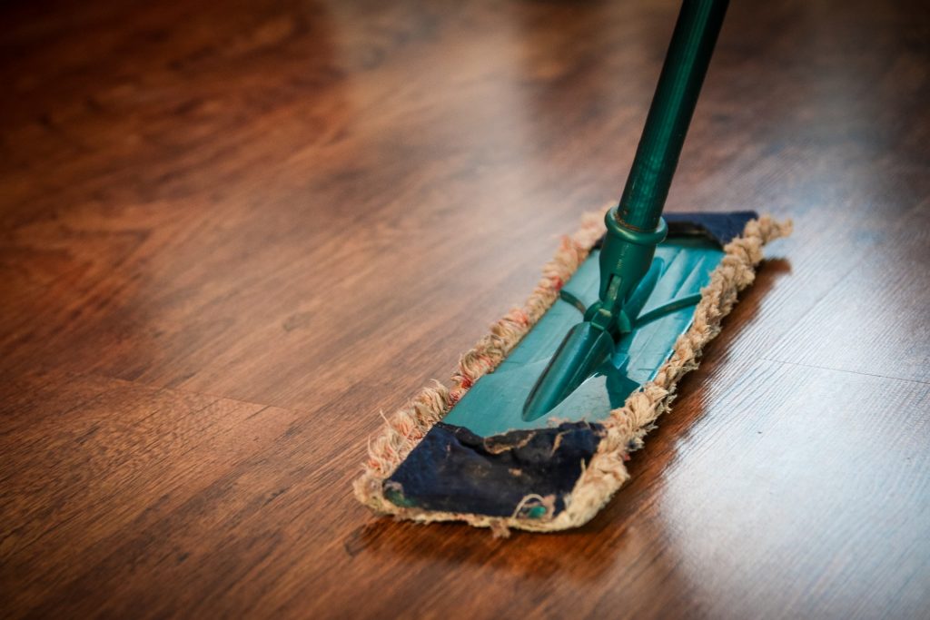 Wooden floor being cleaned