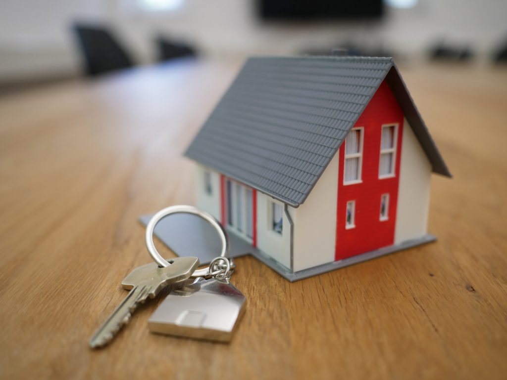 A miniature of a house on a wooden floor