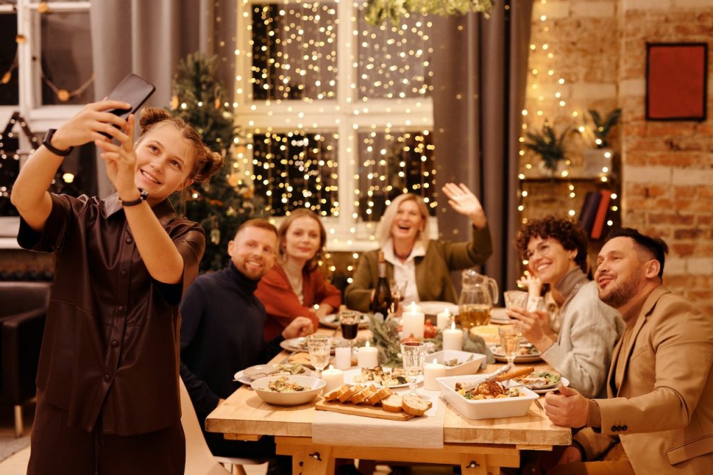 A family enjoys the warm, cozy interior design enhanced by their choice of dark-colored drapes.