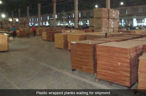 plastic wrapped planks waiting for shipment